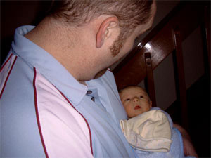 Baby Max stares at his dad